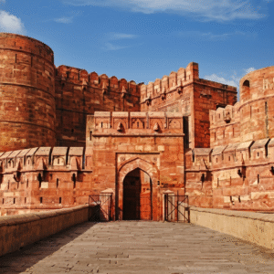 Morning view of the Agra Red Fort in Agra paired with evening Ganga Aarti rituals on the ghats of Varanasi during a 7-day Golden Triangle tour of North India