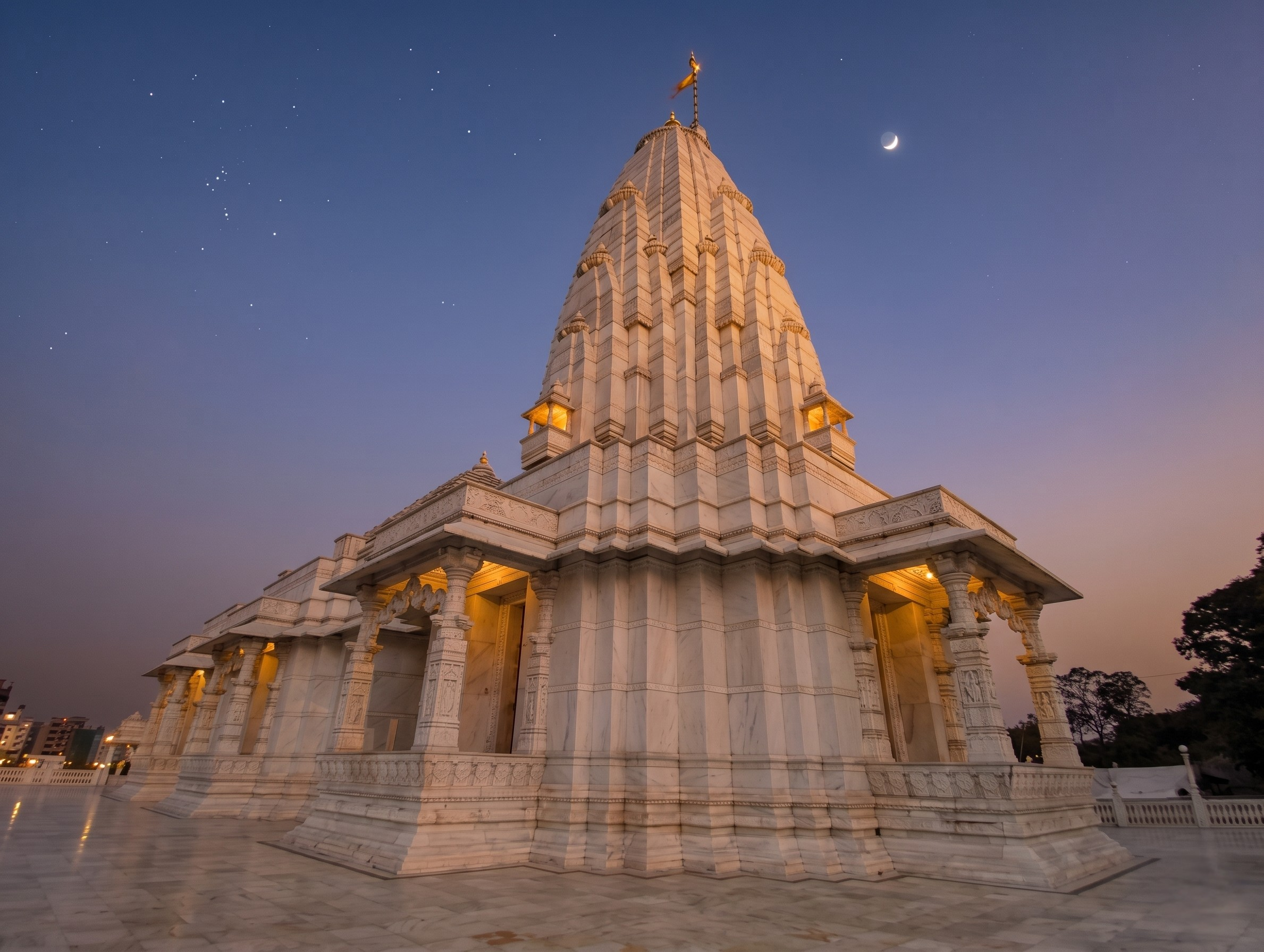 The pristine white marble facade and carved domes of the Laxmi Narayan Birla Mandir Jaipur under a clear sky.