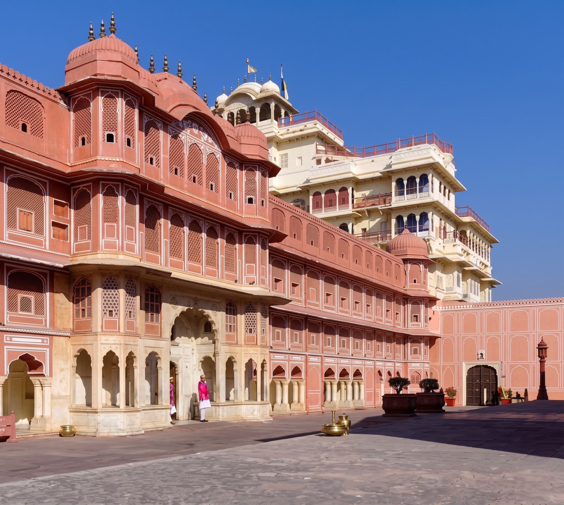 The beautifully decorated inner courtyard and colorful doorways of the historic City Palace Jaipur complex.